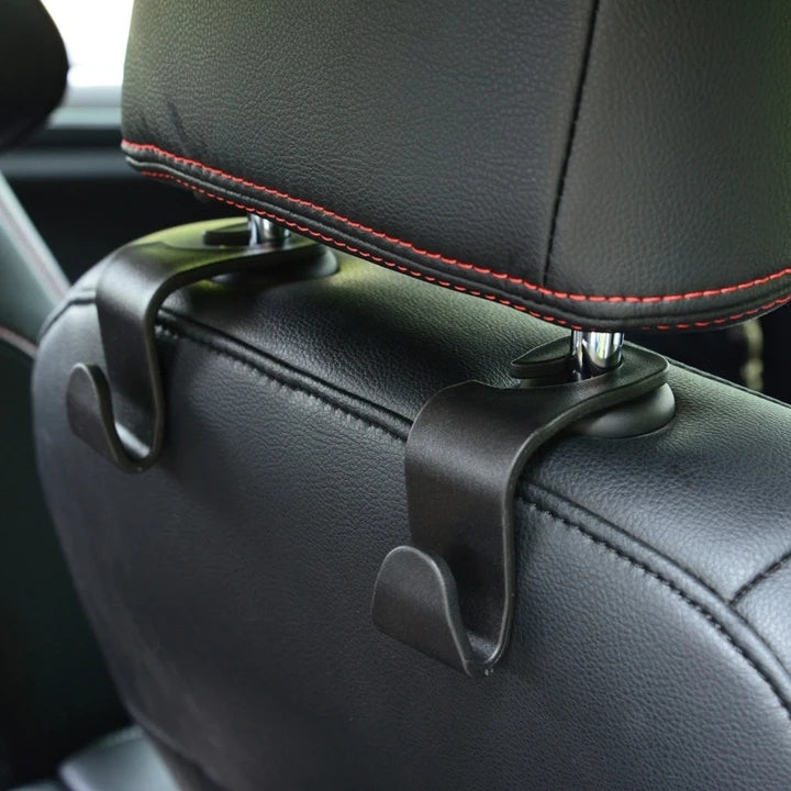 Car headrest hook clipped onto headrest post