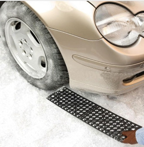 Tire traction mat folded flat for storage