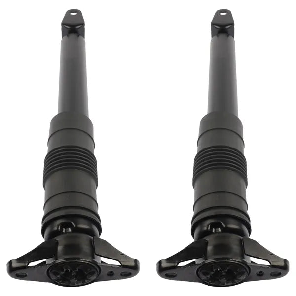 Close-up of rear shock strut coil spring and mount
