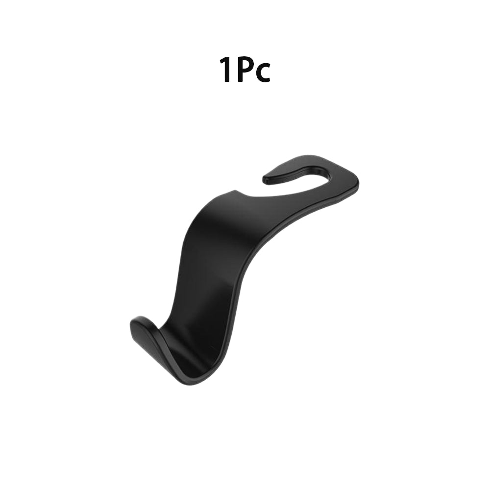 Car headrest hook holding a purse